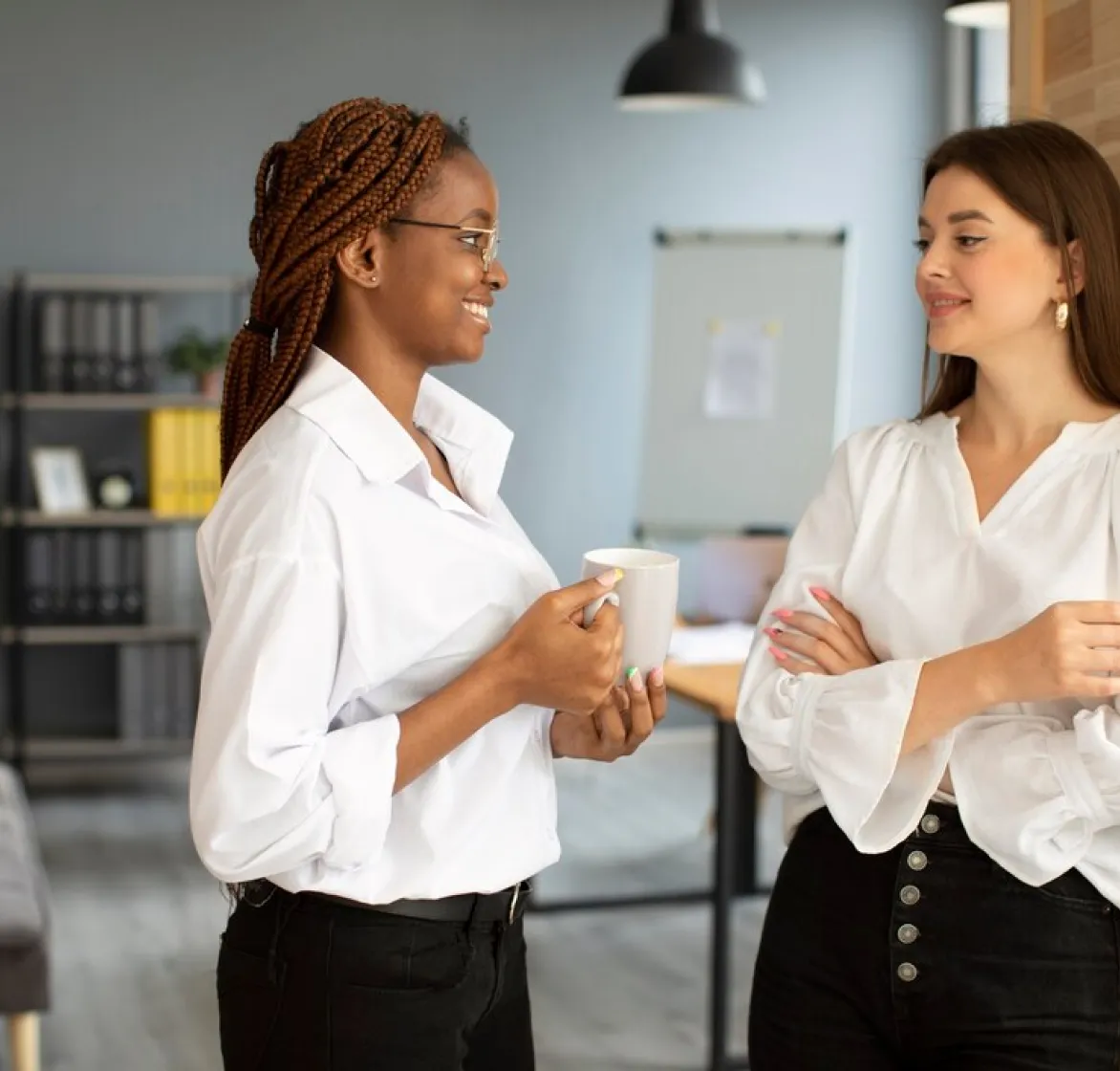 Two women discussing work